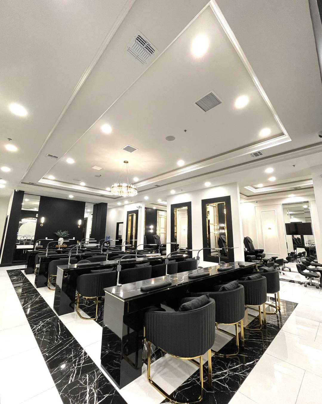 Ja'noir Nail Lounge — main floor with crystal chandelier
