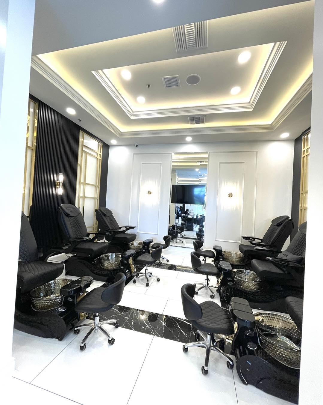 Ja'noir Nail Lounge — private pedicure room with art deco ceiling