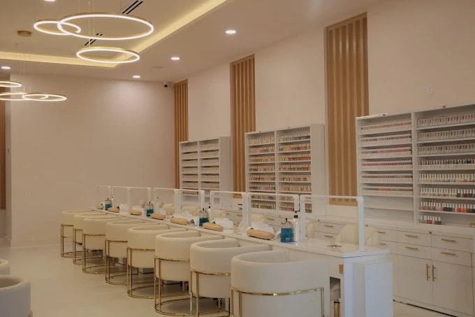 Mimi Mai Nail Spa — manicure stations with custom millwork polish wall